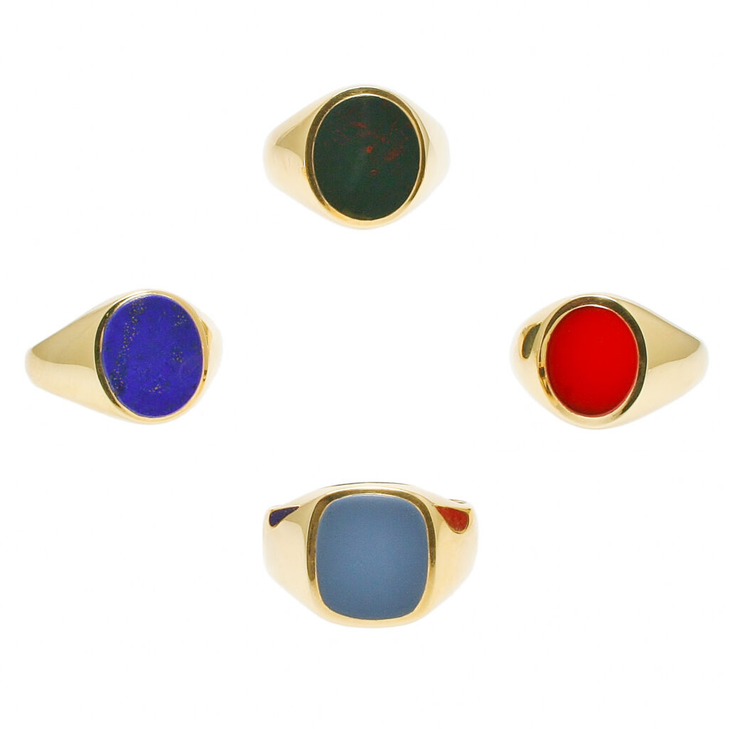 four gold Stone set signet rings,
